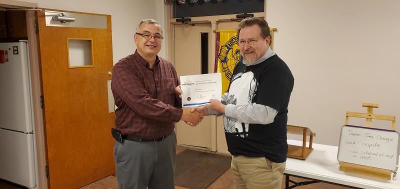 Doug Price presents Matt Henson with his Pathways Level 3 certificate.